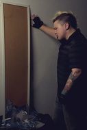 Man and broken mirror