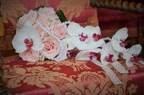 wedding bouquet with roses and orchids