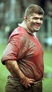 rugby player in the mud on blurred background