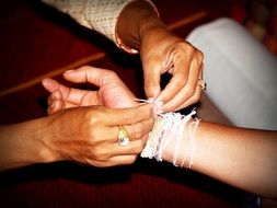 tying bracelets