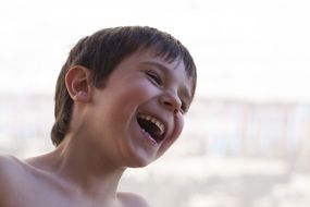 boy laughs on the street