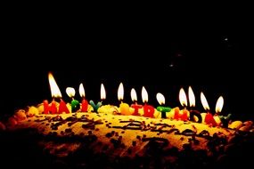 candles in the form of letters on a birthday cake