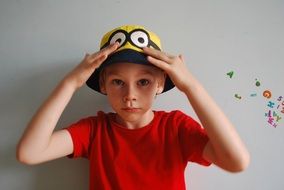 baby in hat with minions