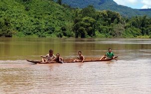 children in a boat in the countryside