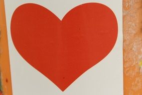 red heart on a white piece of paper