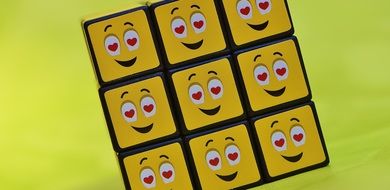 yellow cube with emoticons