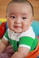 happy baby with a big head