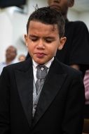sad boy in black suit