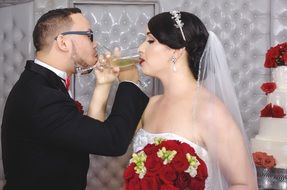 newlyweds with glasses of champagne