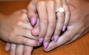 hand with engagement ring