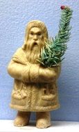 figurine of a man with a christmas tree