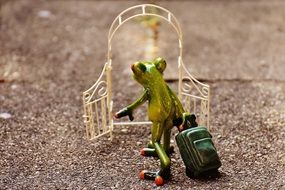 statue of a frog traveler