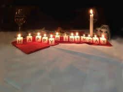 happy birthday candles on the festive table