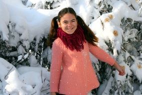 girl among the snow-covered park