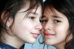 faces of two sisters close-up