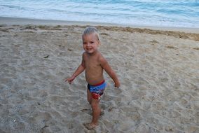 happy boy on summer beach