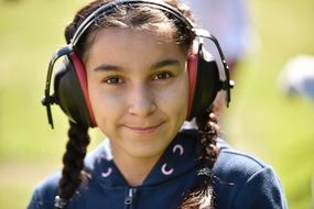 pretty young Girl with Braids in headphones