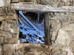 Devastation, stone ruin with broken window