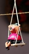 doll puppet on a swing