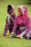 newlyweds in bright traditional dresses