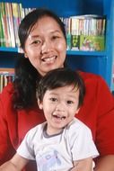 Mother with the son in the library