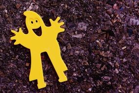 yellow plastic ghost on asphalt