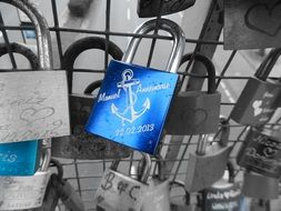 blue castle with an anchor on a metal fence