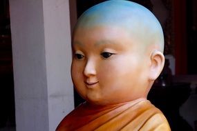 stone figure of a bald buddha