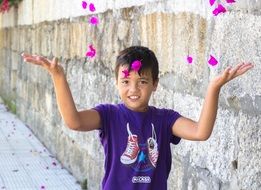 baby with rose petals