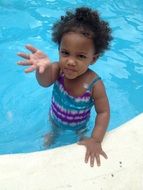 little girl afro american in the pool