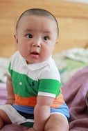 baby in striped clothes