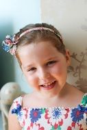 photo portrait of a smiling girl in a floral dress