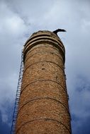 brick Chimney with ladder at sky