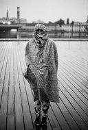 girl dressed up in raincoat