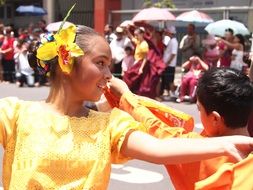 smiling dancing children in costumes