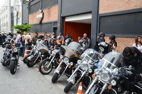 many bikers on a city street