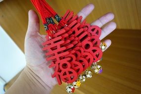 many happy hanging bells in hand