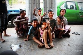 happy kids are sitting on the floor