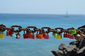 locks of different colors on a chain