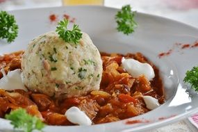 Goulash Dumpling meal on white plate