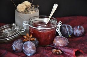 plum jam in a glass jar