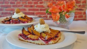 plum cake with cream and berries