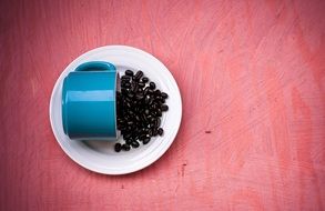 coffee beans on a blue cup background