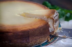 piece of Cheesecake on Table Dessert Cream