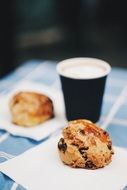 two Muffins and Cup on table