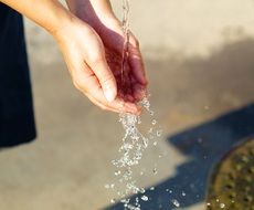 Water flow to womanâs Hands