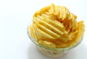 potato curly chips in a transparent plate