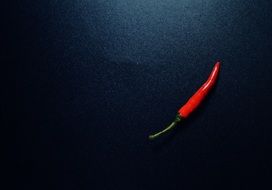 Red Chili Pepper at black background