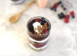 Yoghurt,berries and nuts in the glass