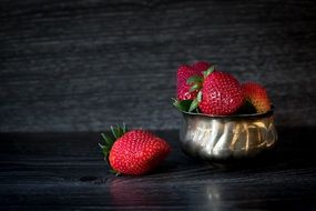 red Delicious Strawberries in bowl closeup